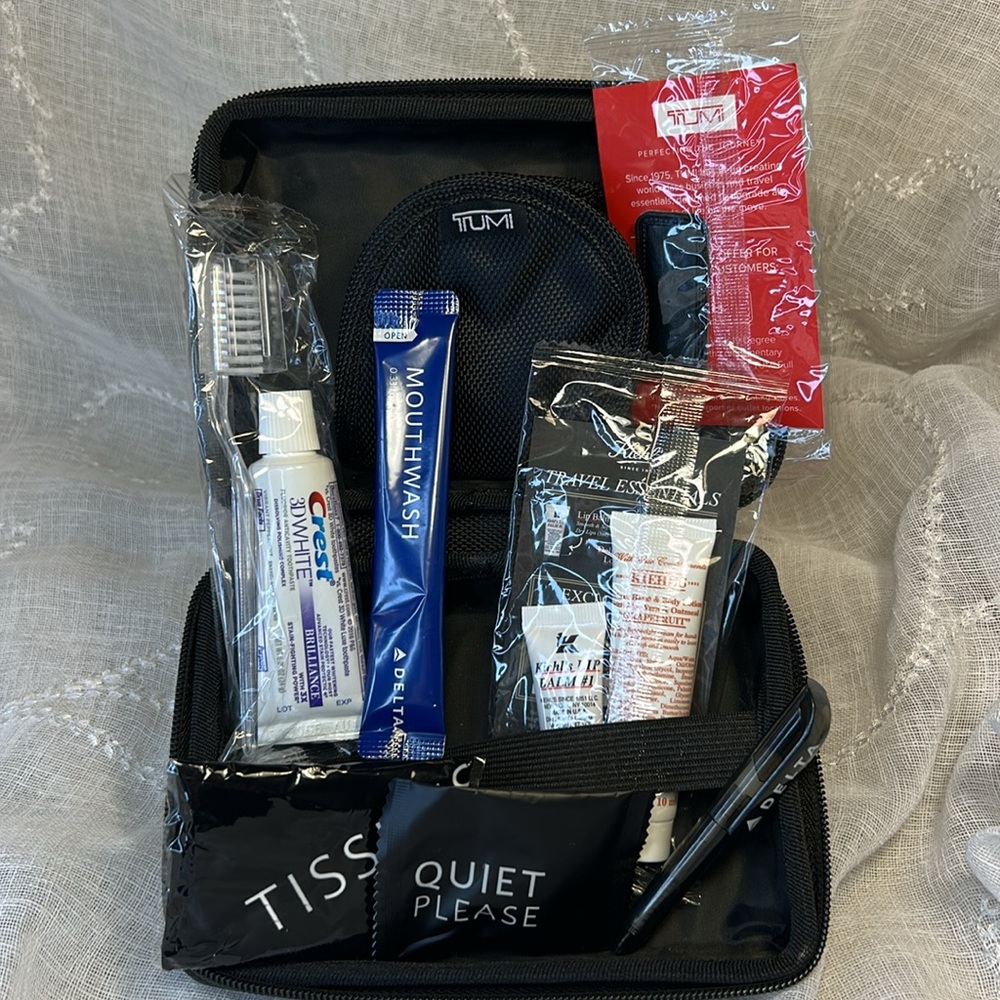 Tumi hard case luggage cosmetic bag filled with goodies for your next trip - Picture 2 of 10